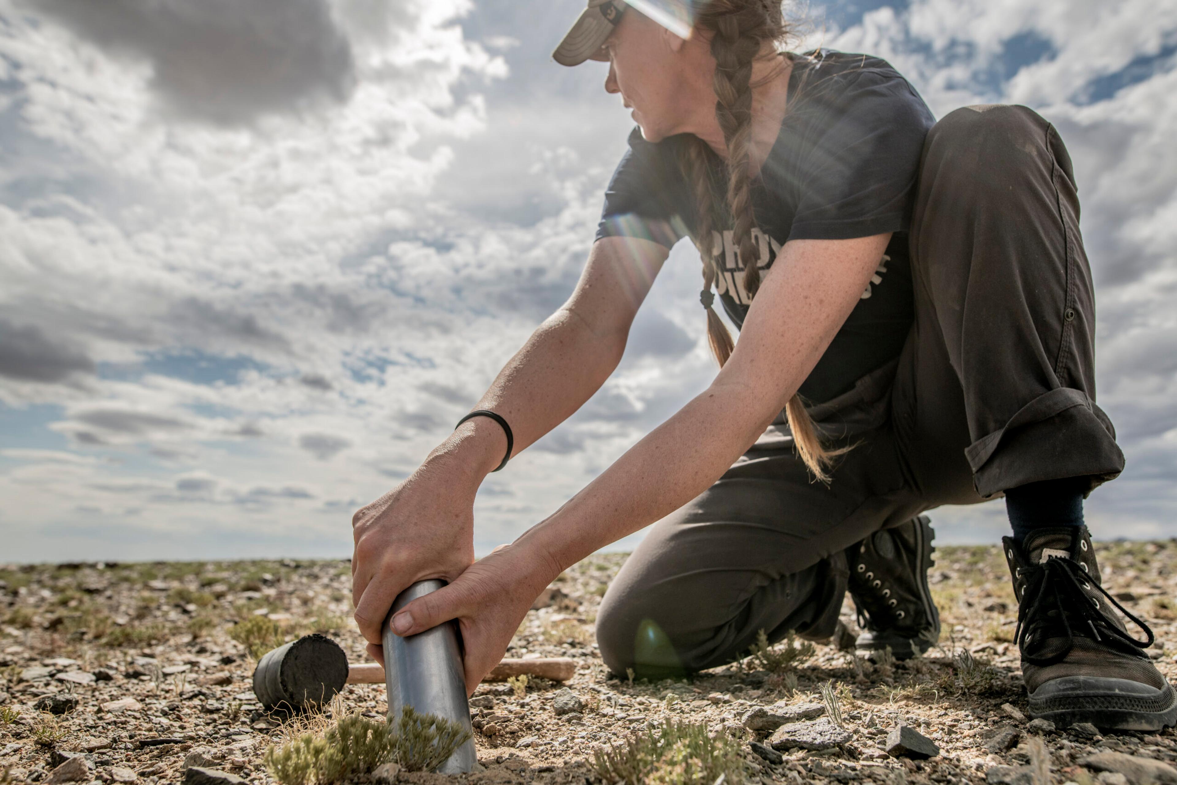 The scientist on an open plain in mongolia.
