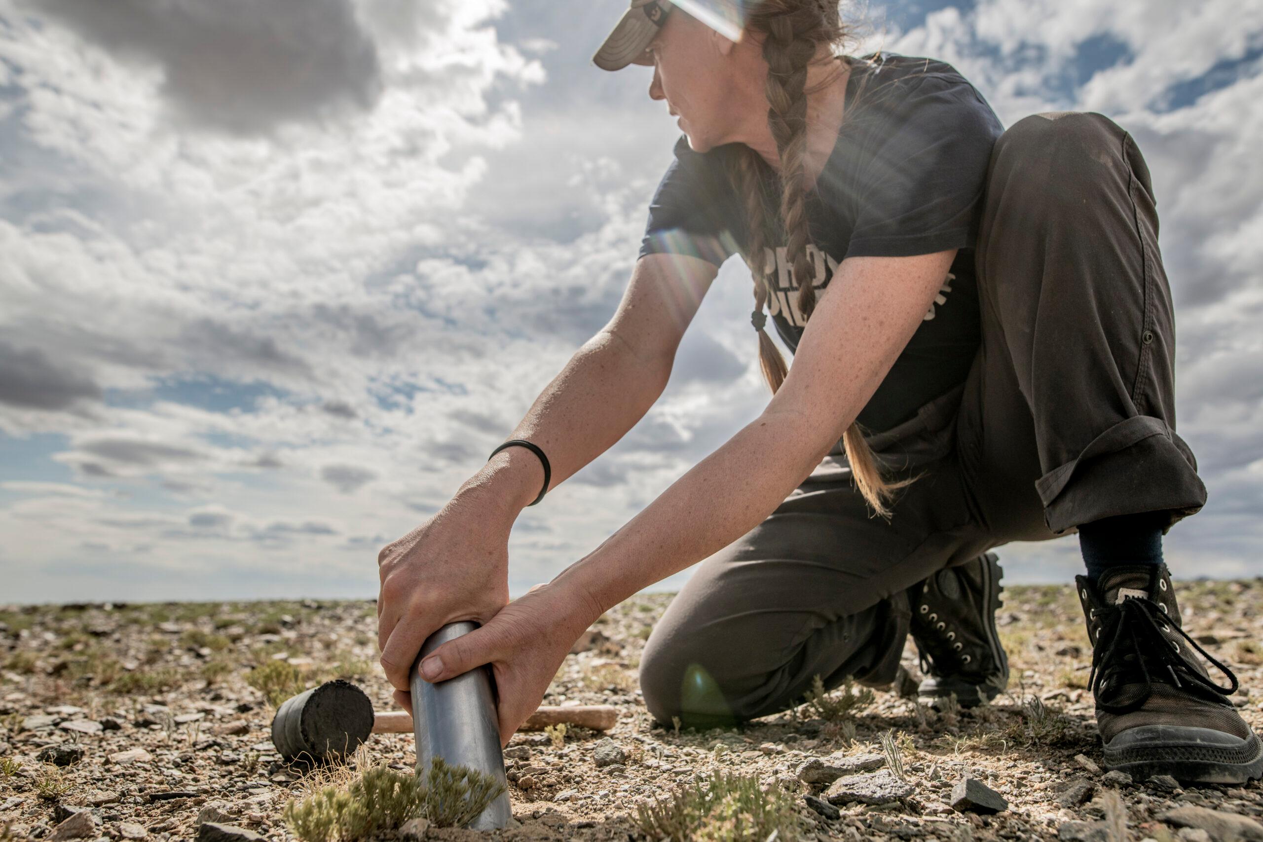 The scientist on an open plain in mongolia.