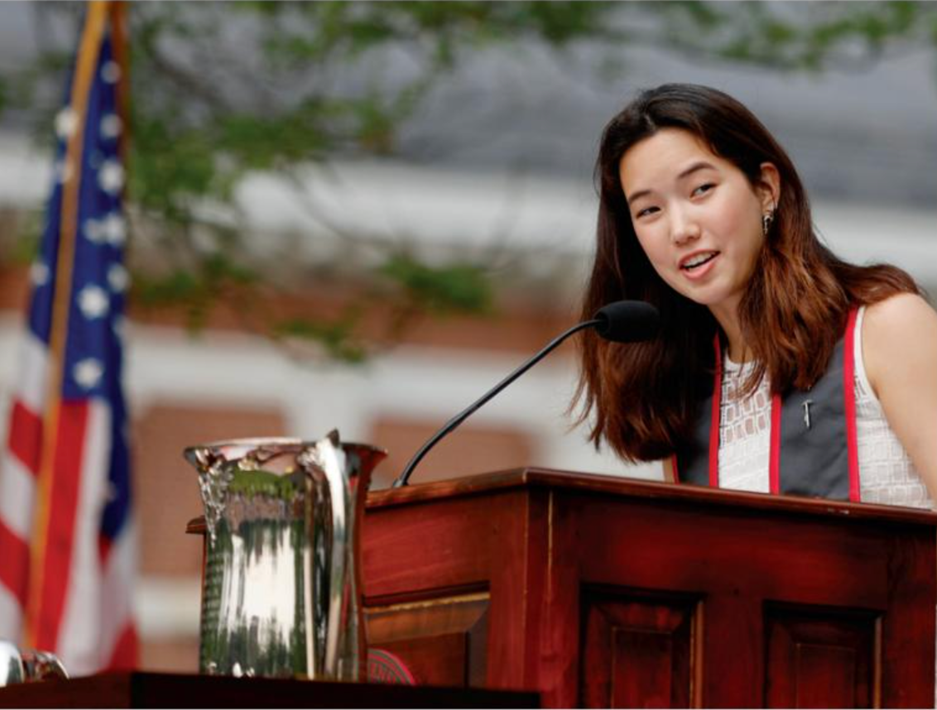 speaking at a podium