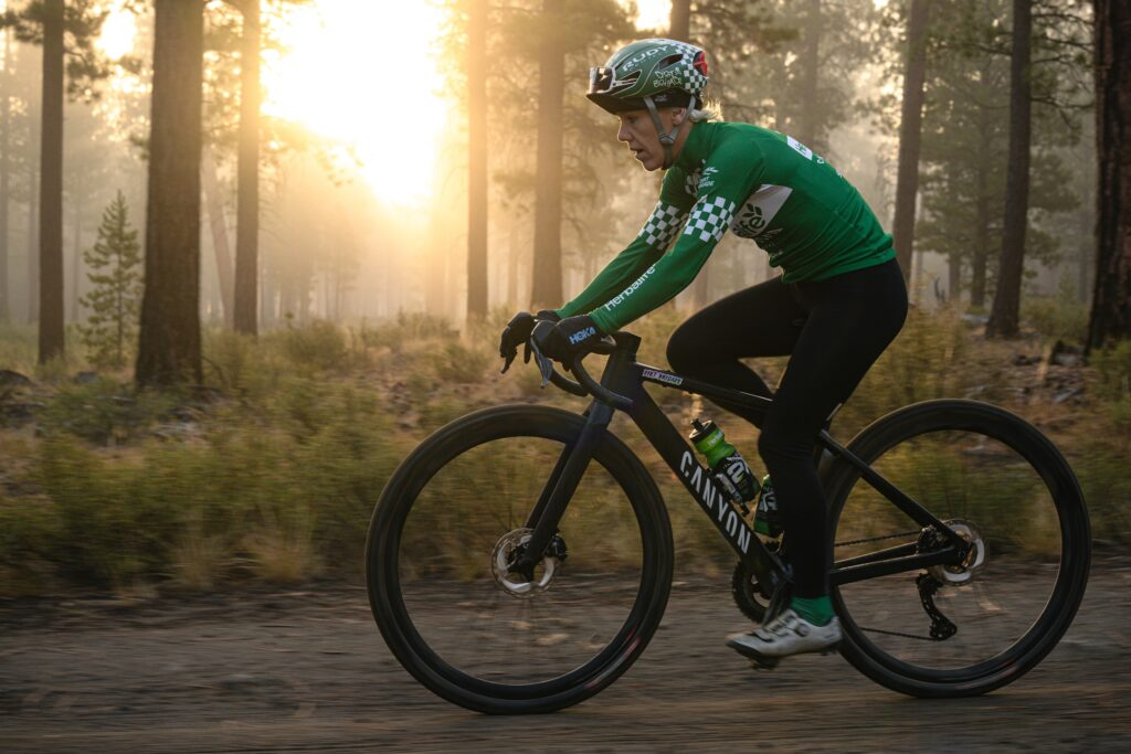 “The training is all consuming,” says Heather Jackson ’02, pictured here on a ride in the Oregon woods.