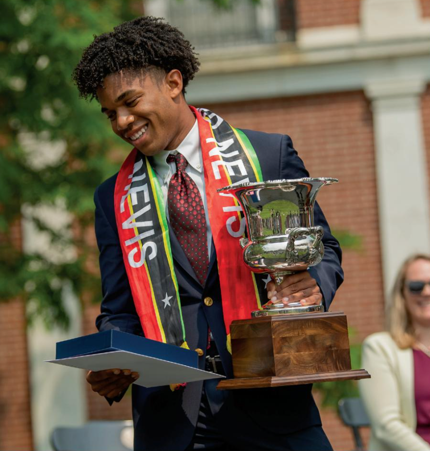 person holding award