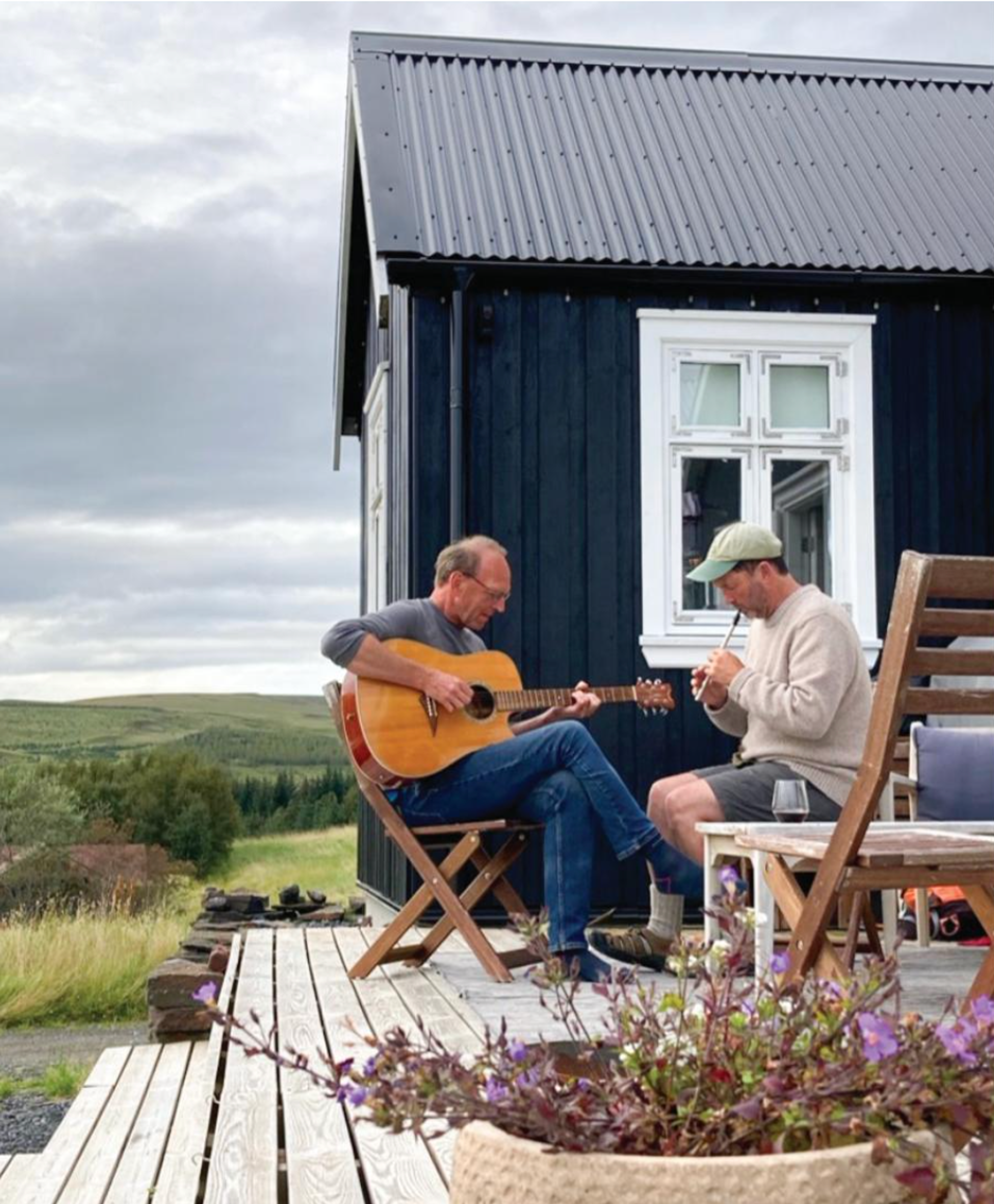 Man playing guitar outside.