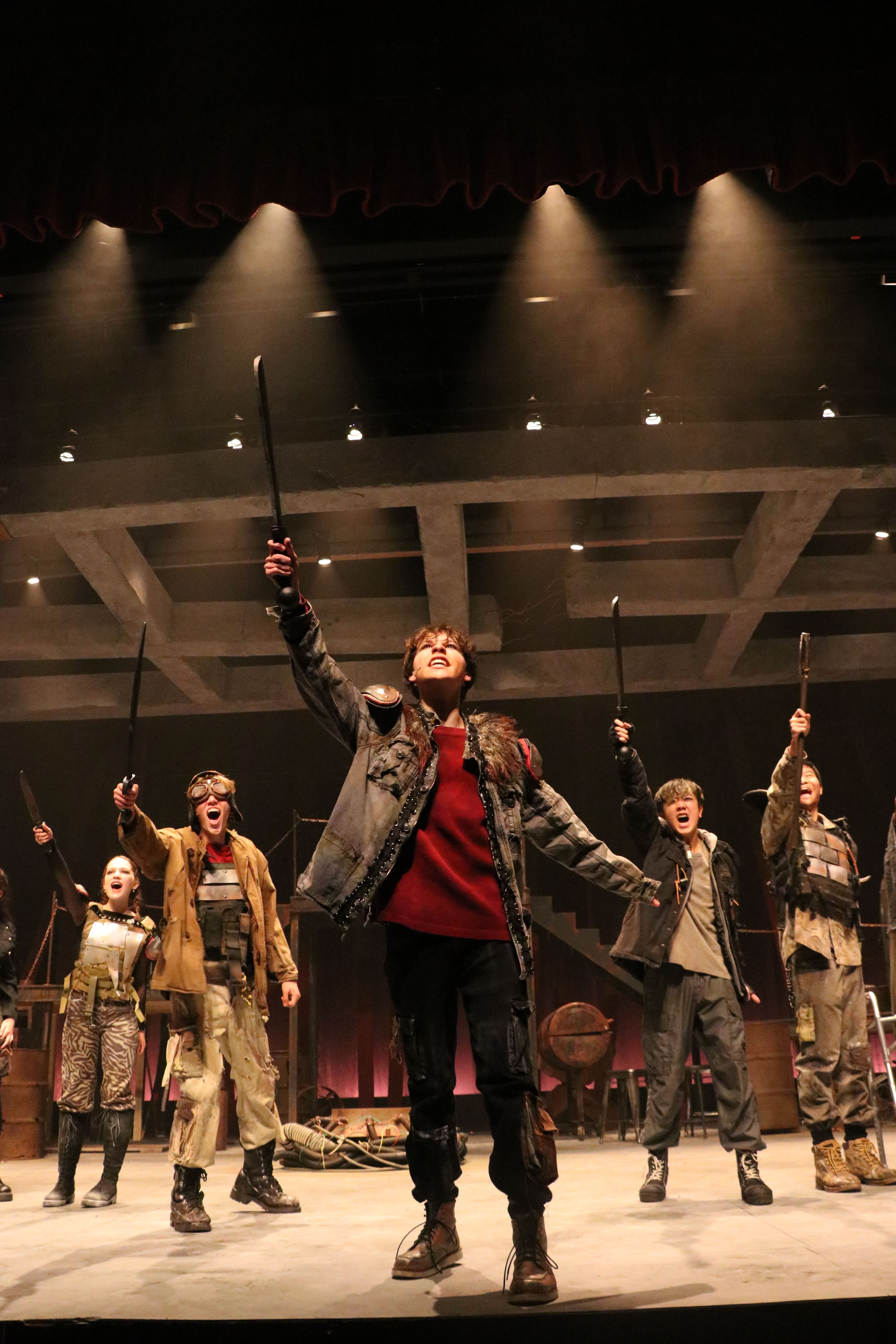 play production with students on lit stage