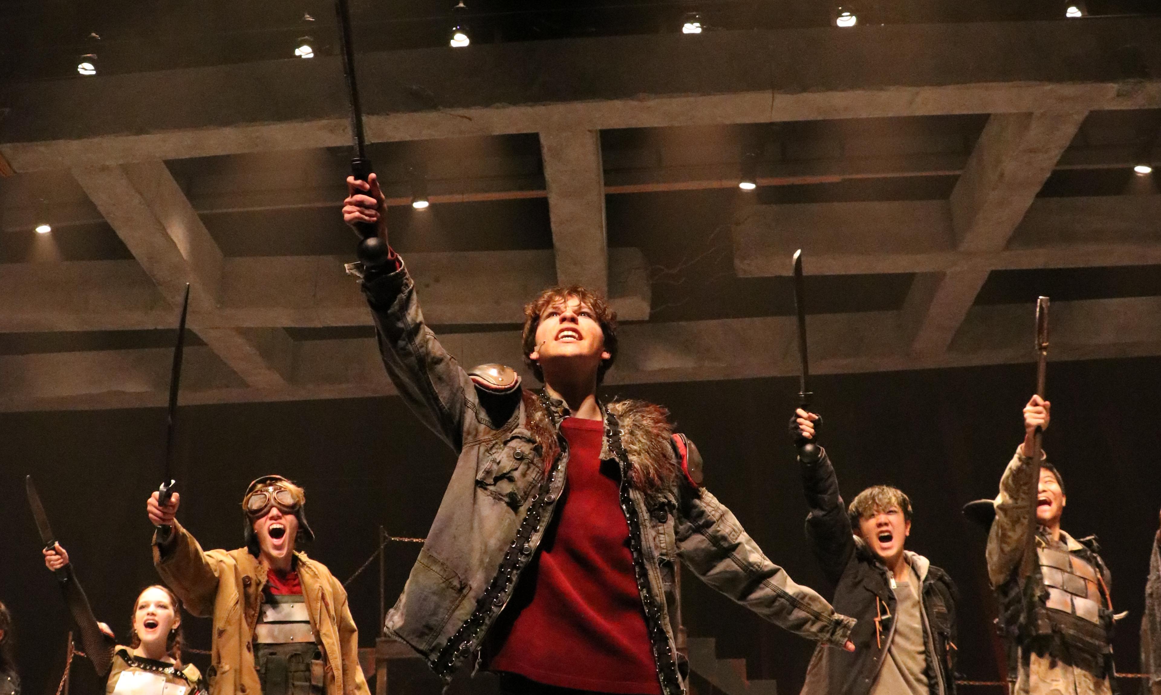 play production with students on lit stage
