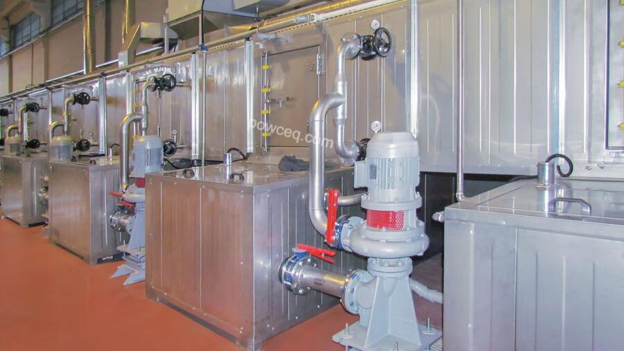 Industrial powder coating curing oven: interior view showing loaded rack and heating elements
