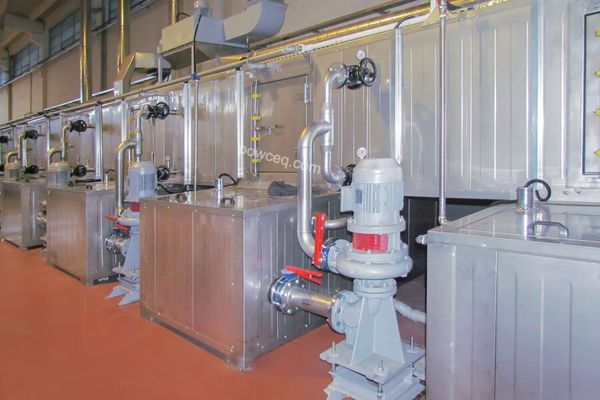 Industrial powder coating curing oven — interior view showing loaded rack and heating elements
