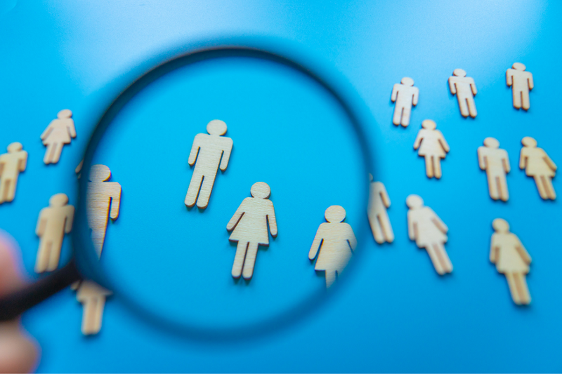 Figures under magnifying glass