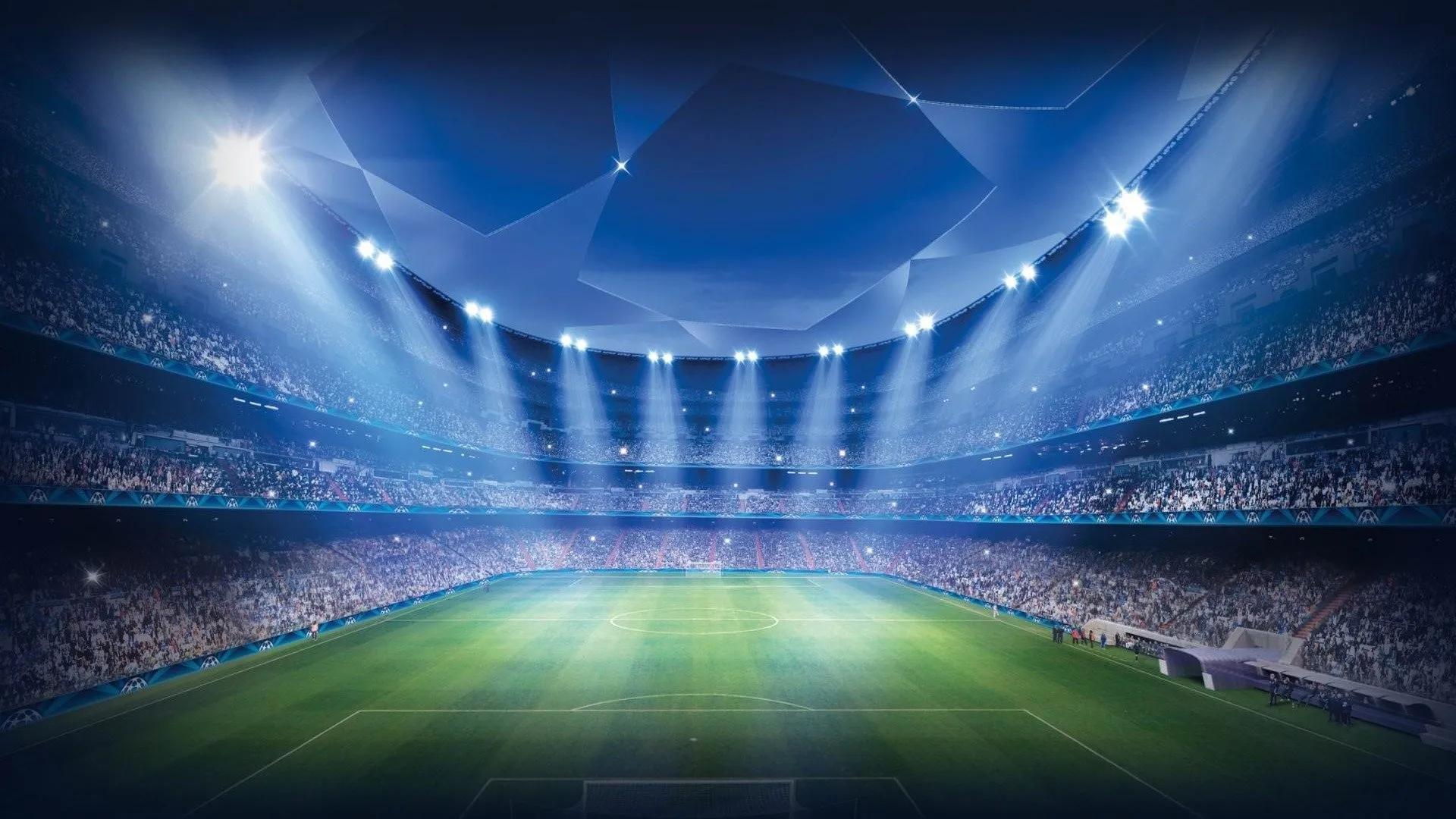 Football pitch lit up with spotlights
