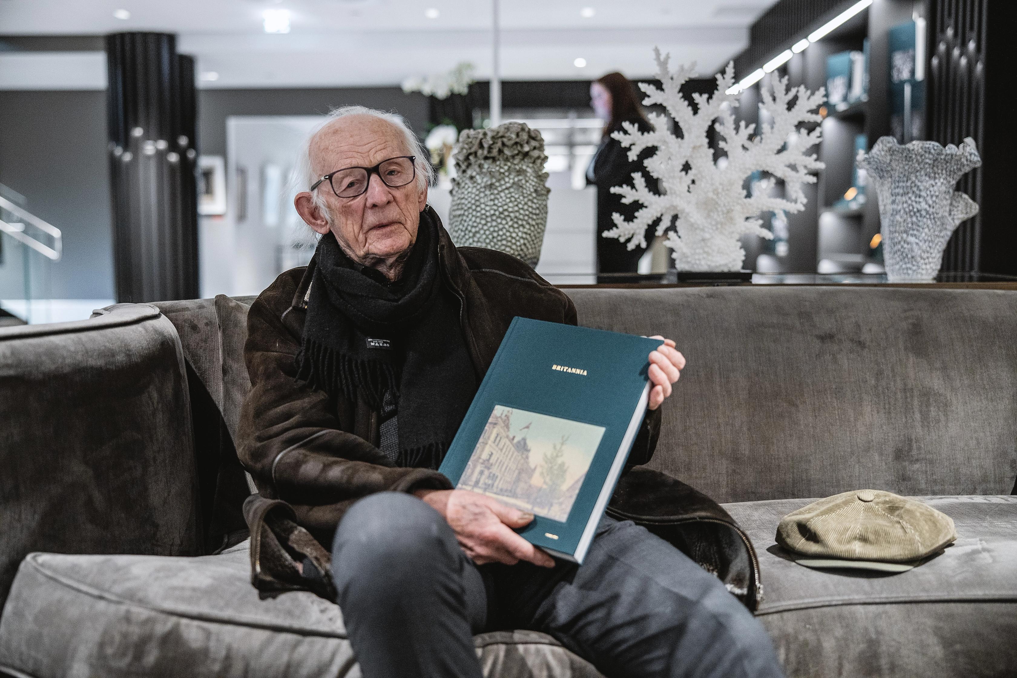 Håkon Bleken holding Britannia Hotels coffee book