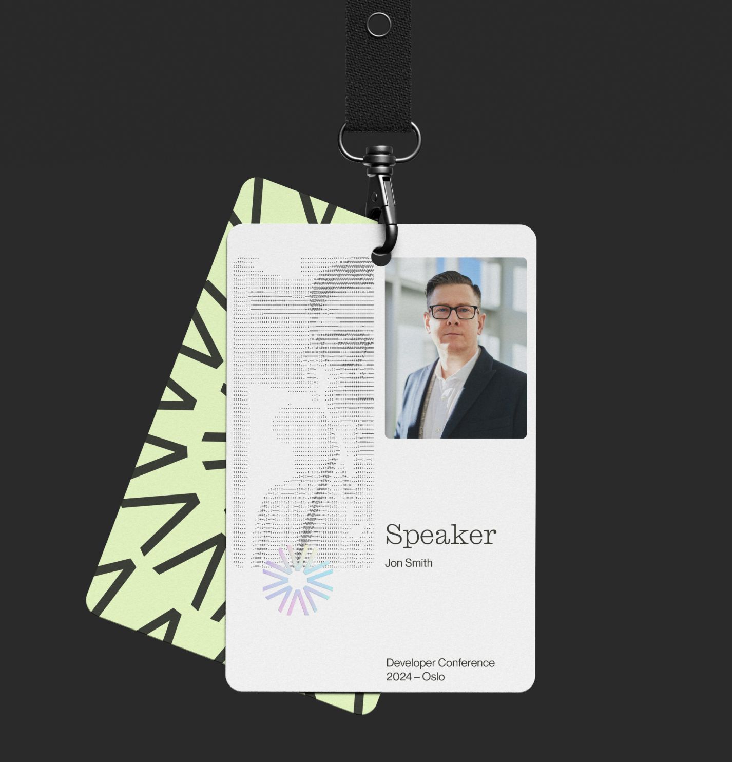A speaker badge for Jon Smith at Developer Conference 2024 in Oslo featuring ASCII art and a headshot — by Nonspace