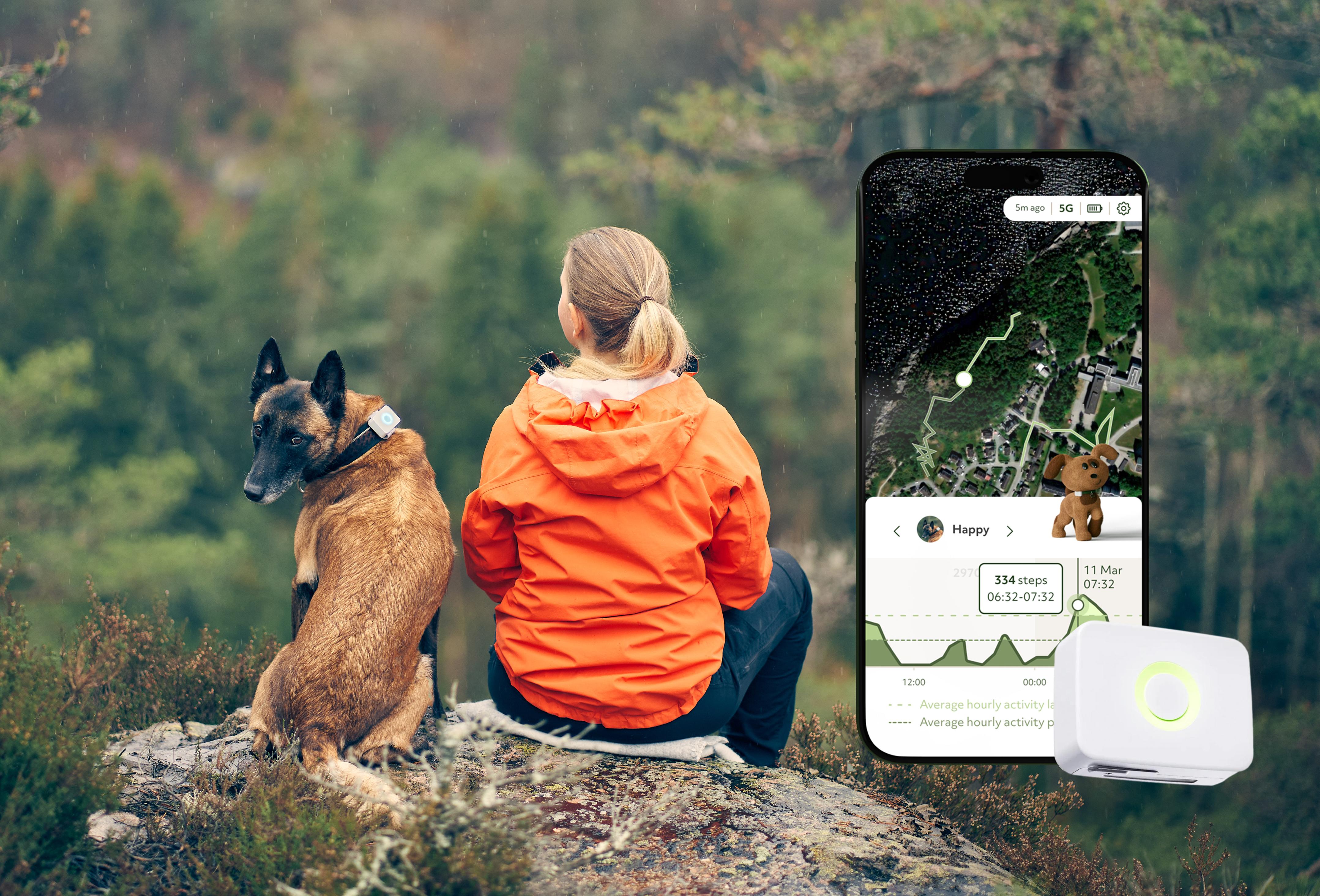 Woman and dog sitting on hilltop with Lildog app
