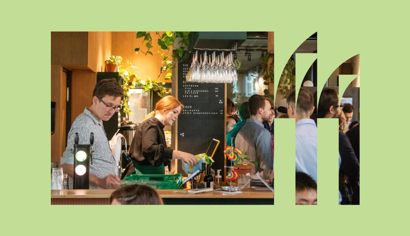 People socializing in a lively Trondheim café, with bartenders preparing drinks and greenery creating a warm atmosphere — part of the Trondheim.com brand and website design.