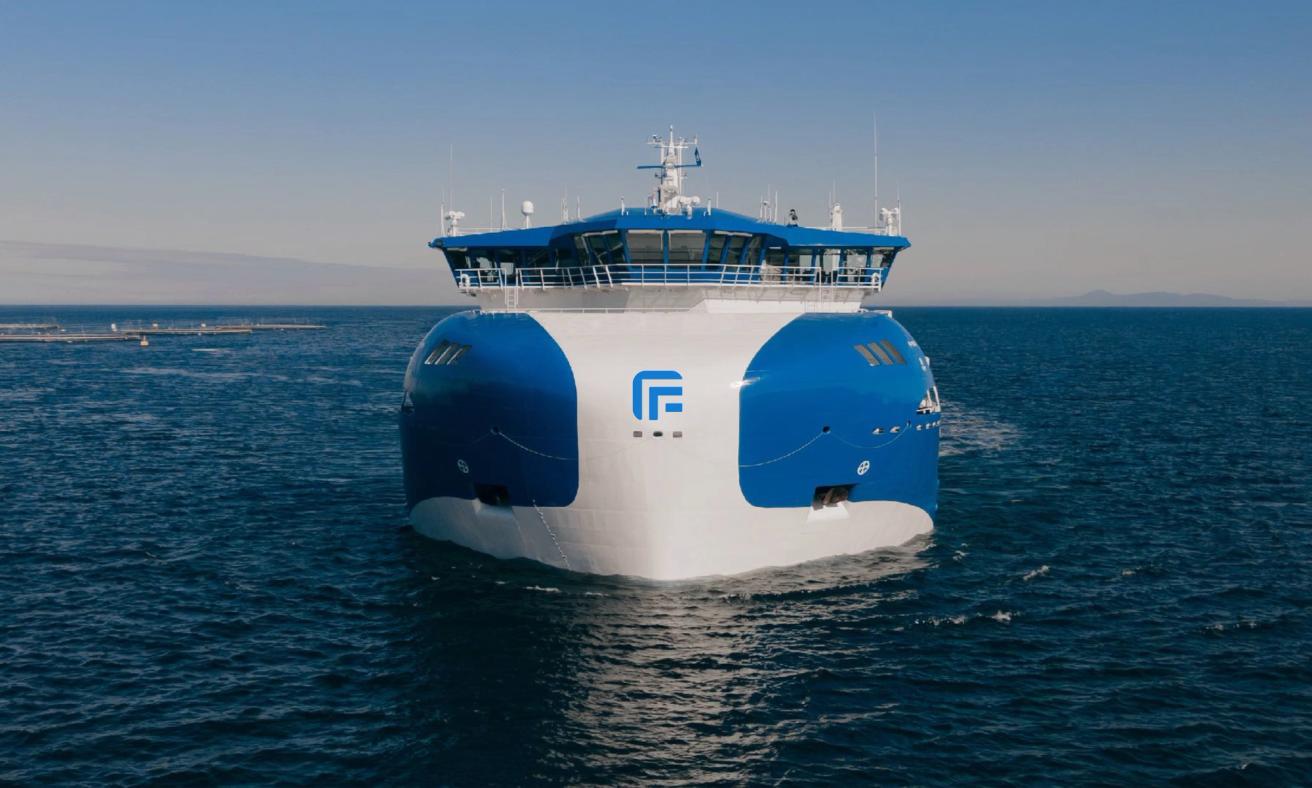A modern blue and white vessel with distinctive curved bow design sailing on calm ocean waters — by Nonspace