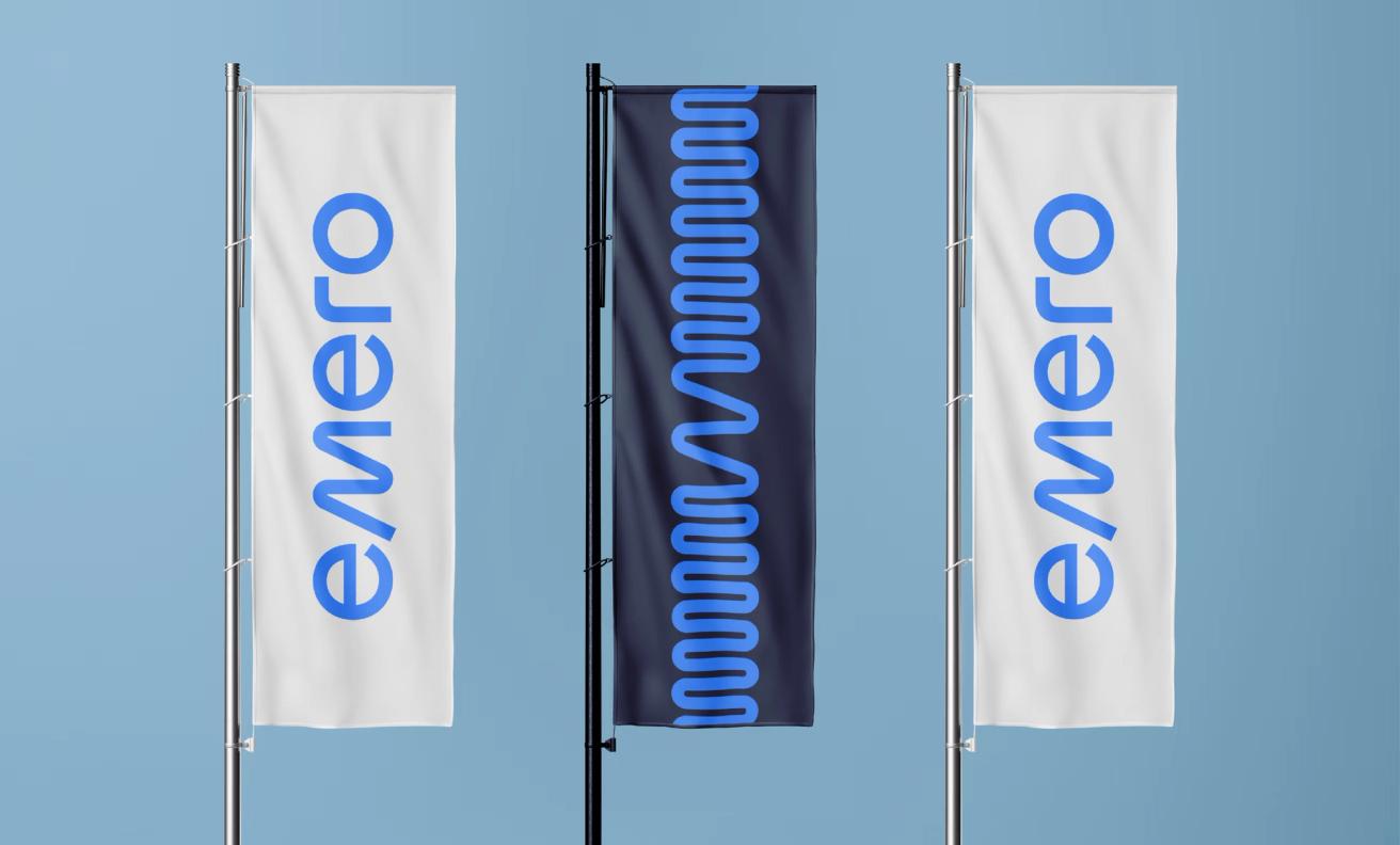 Three vertical flags displaying the Emero logo in blue on white and a wave pattern on dark navy — by Nonspace