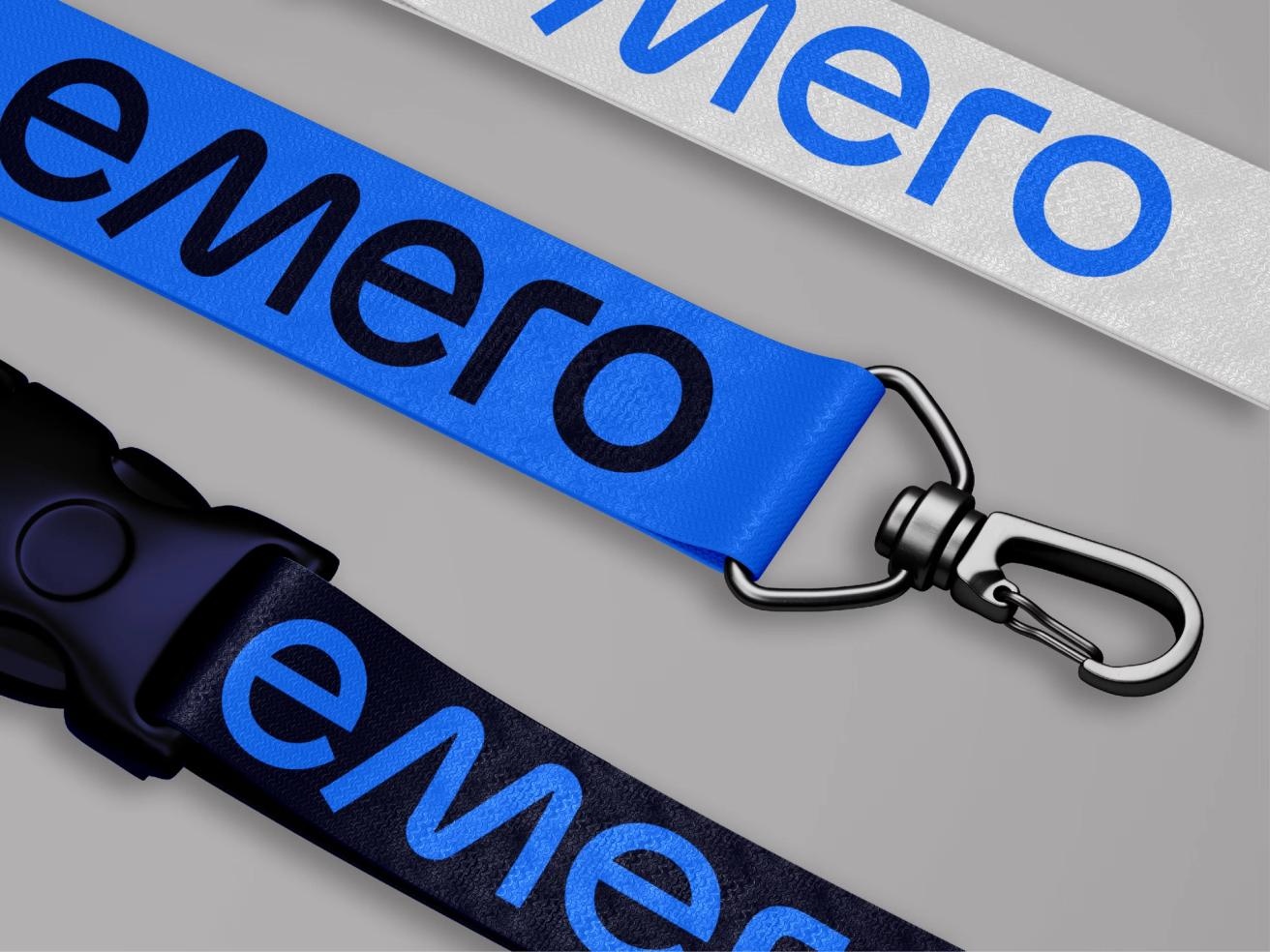 Three branded lanyards in white, blue, and black featuring the emero logo with metal clasps — by Nonspace