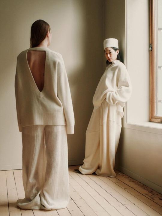 Women in beige sweaters