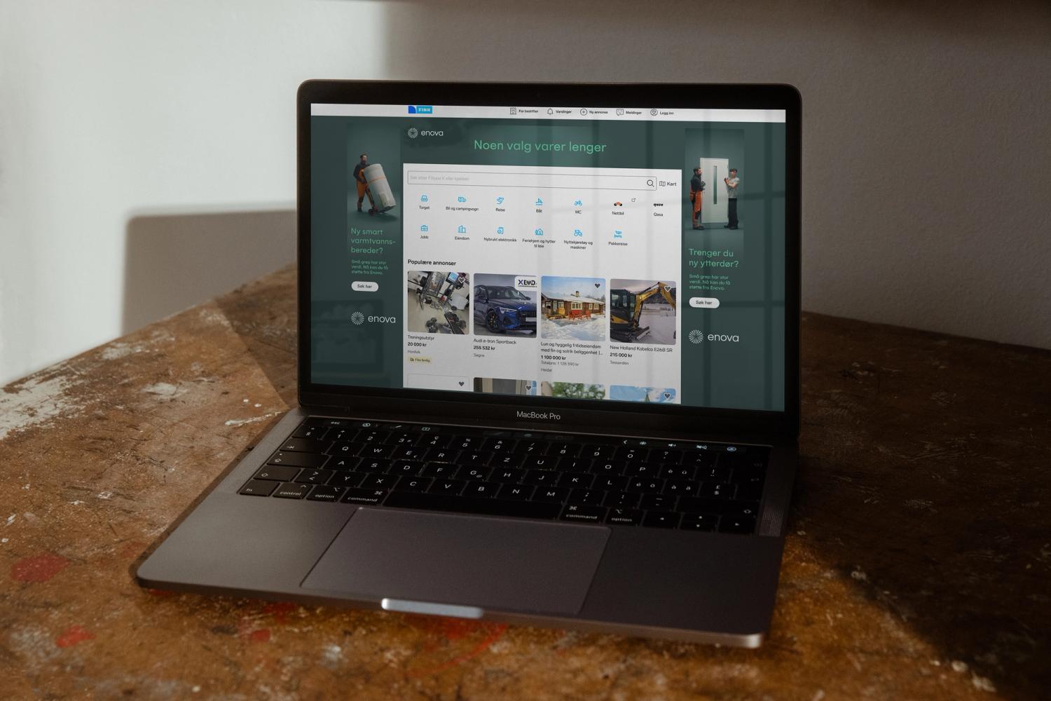 En MacBook Pro viser Finn.no med Enova-annonser for varmtvannsberedere og ytterdører — av Nonspace