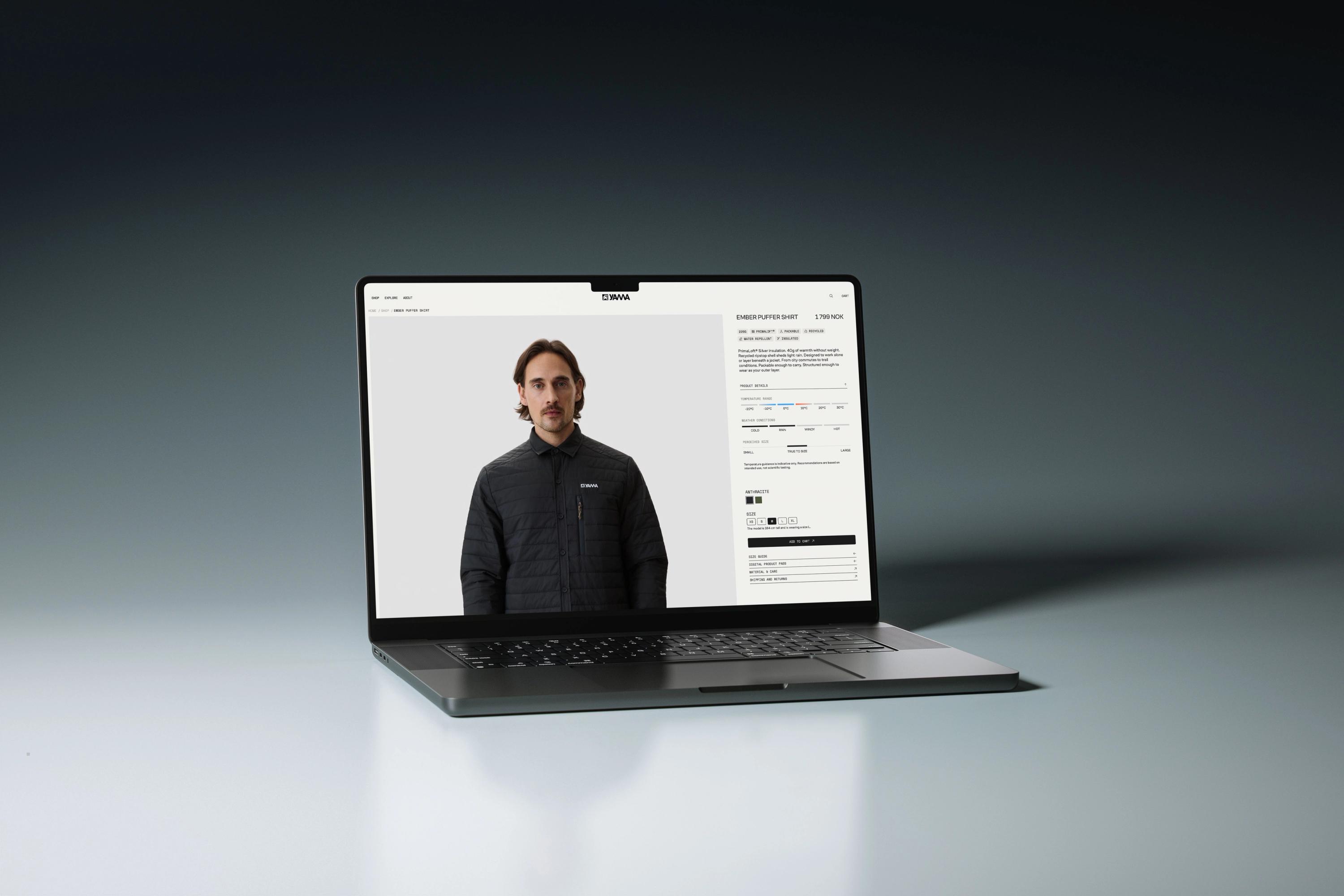 En bærbar datamaskin viser en nettbutikkside for en mørk quiltet skjortejakke fra YAMA — av Nonspace