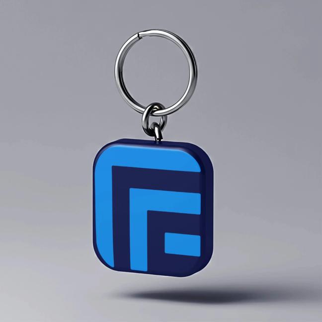 A blue keychain with rounded square shape featuring a geometric "F" logo in light blue and navy — by Nonspace