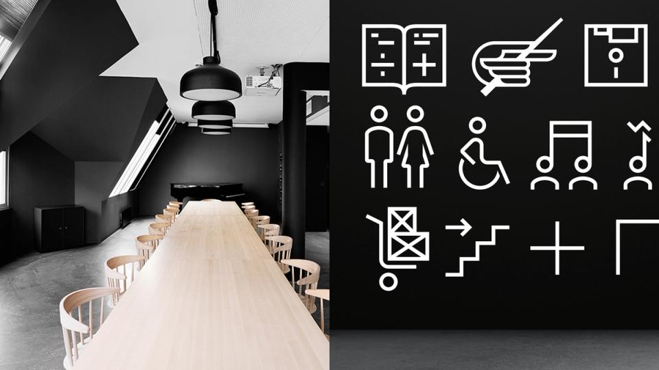 A modern conference room with wooden table and chairs alongside wayfinding icons for an arts festival — by Nonspace