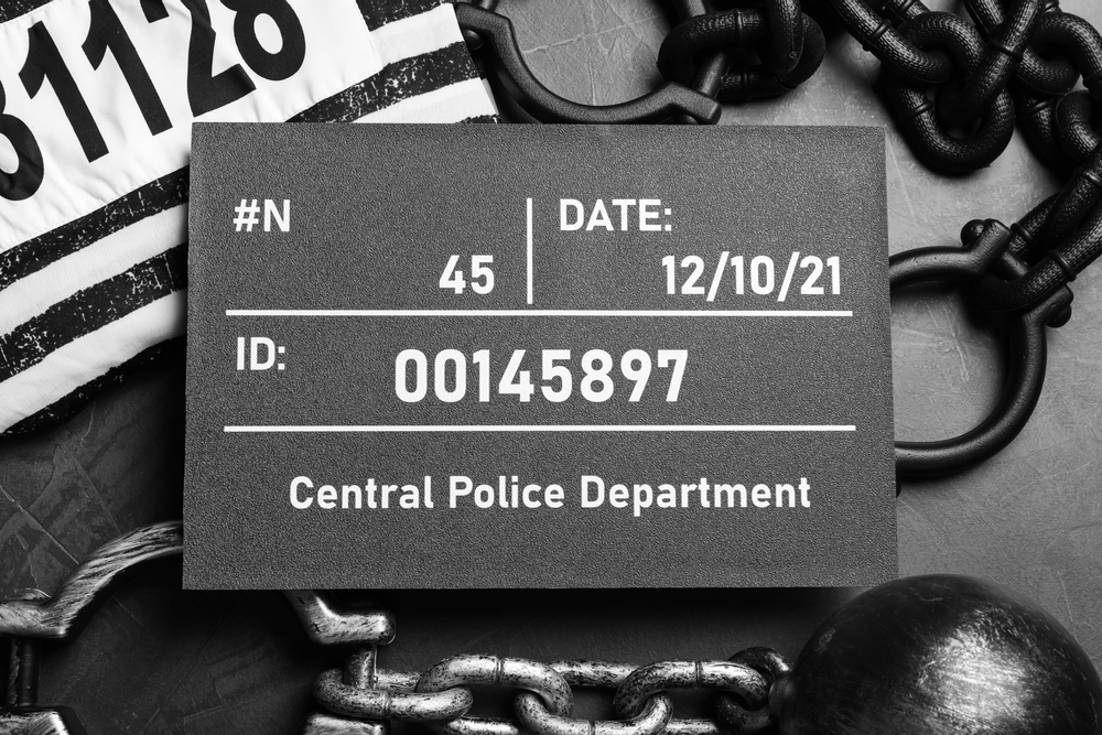 Image Mugshot identification board with inmate number and arrest date, representing a New Jersey expungement mugshot removed from records.