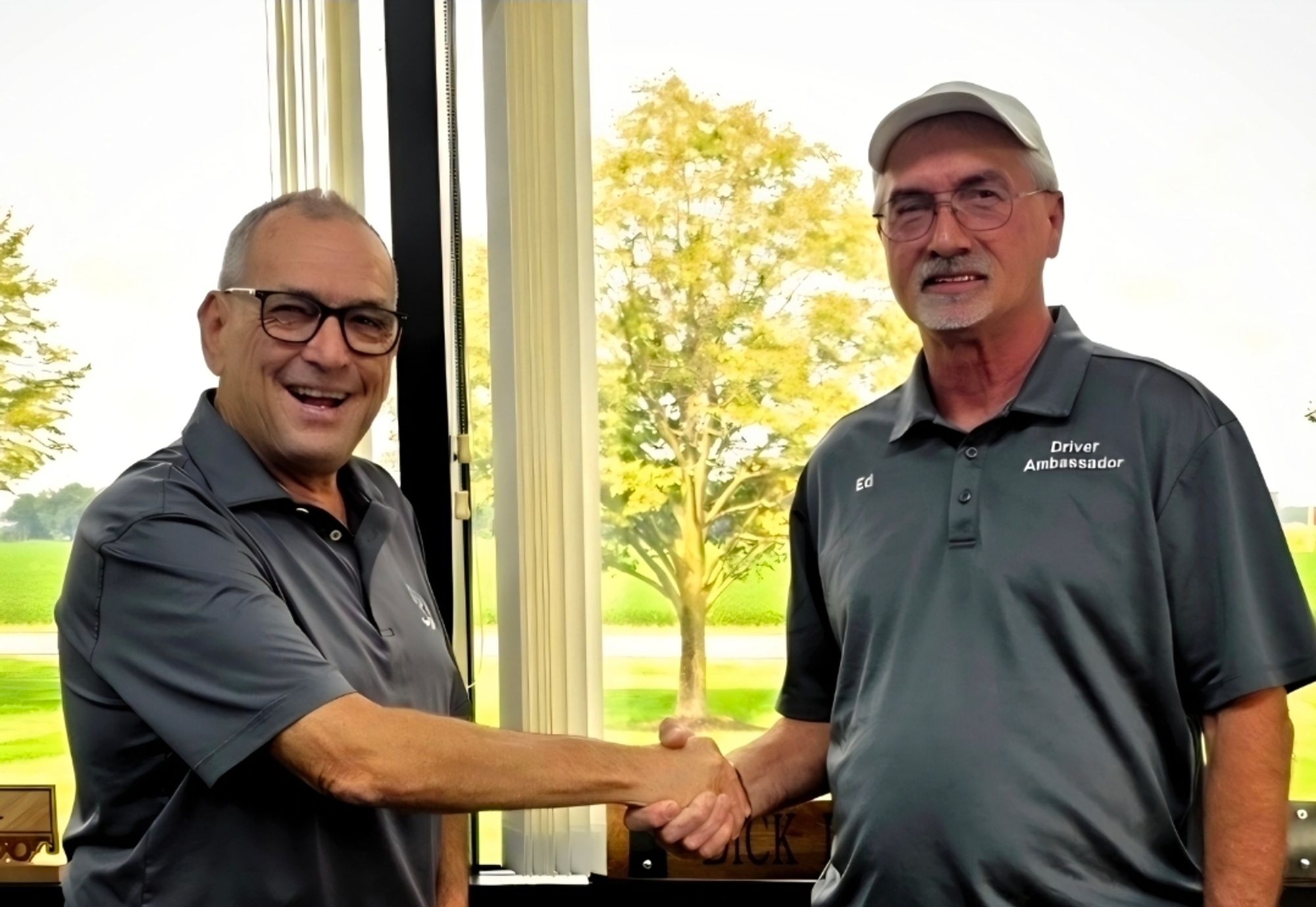 Dick Lavy shaking hands with Driver Ambassador Ed at the Bradford, Ohio office