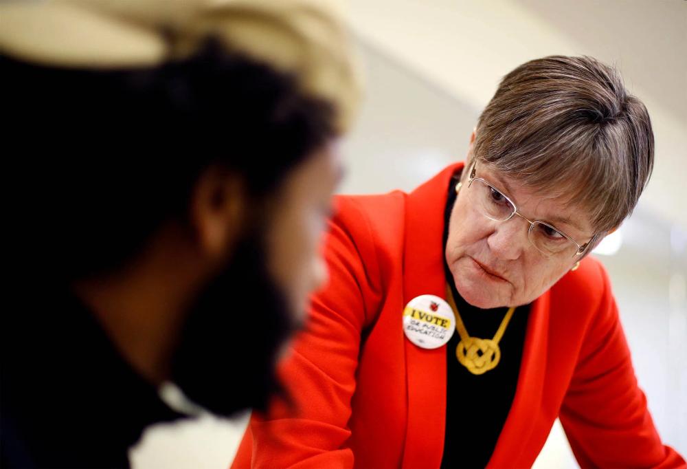 Kansas Governor Laura Kelly speaking with a constituent