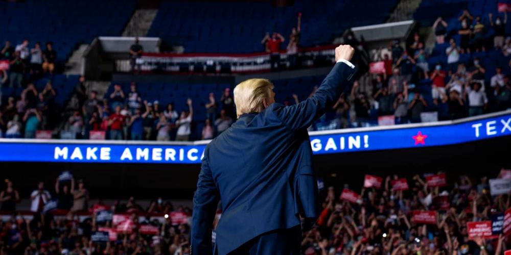 President Donald Trump raising his fist at a rally