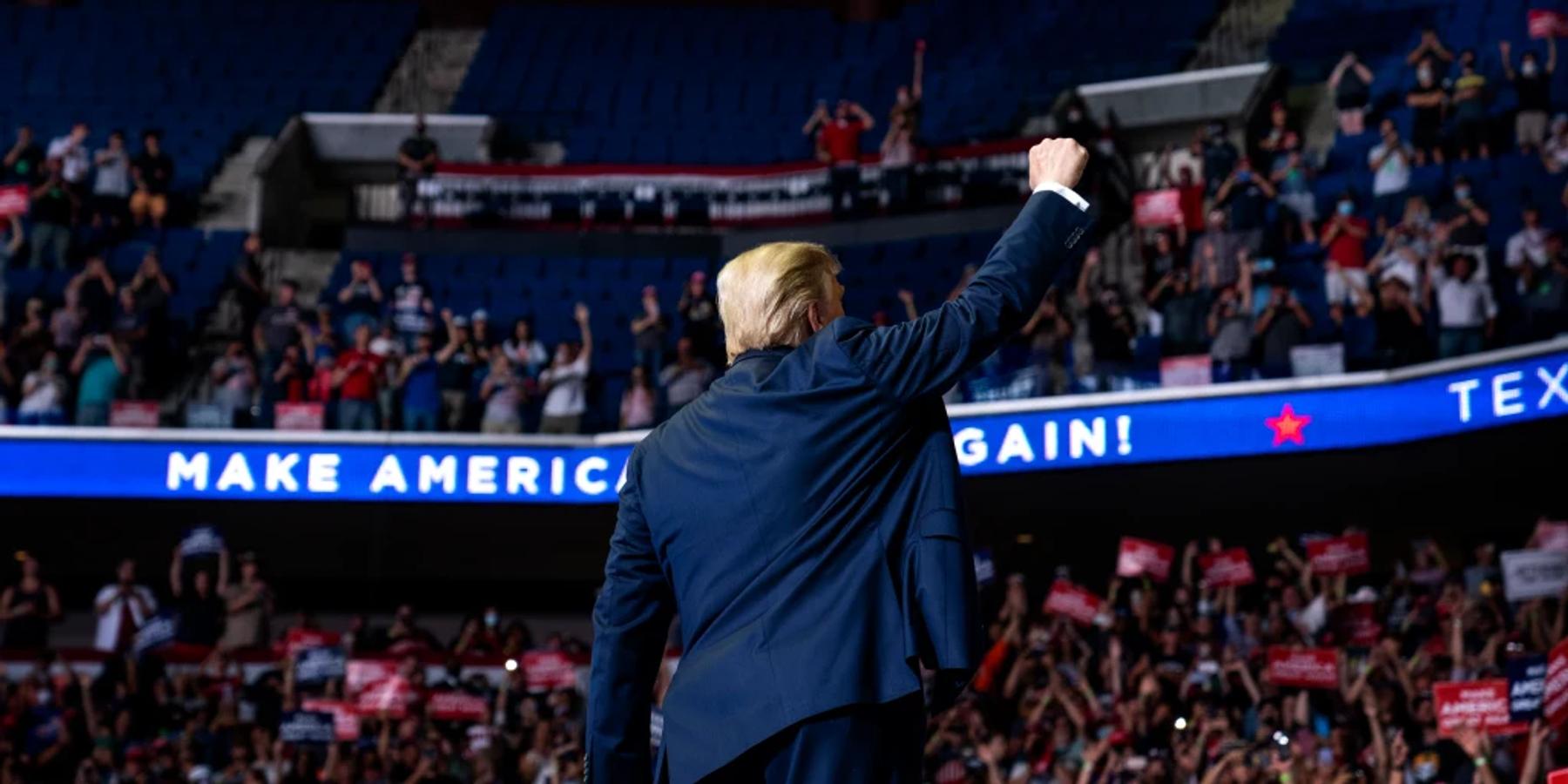 President Donald Trump raising his fist at a rally