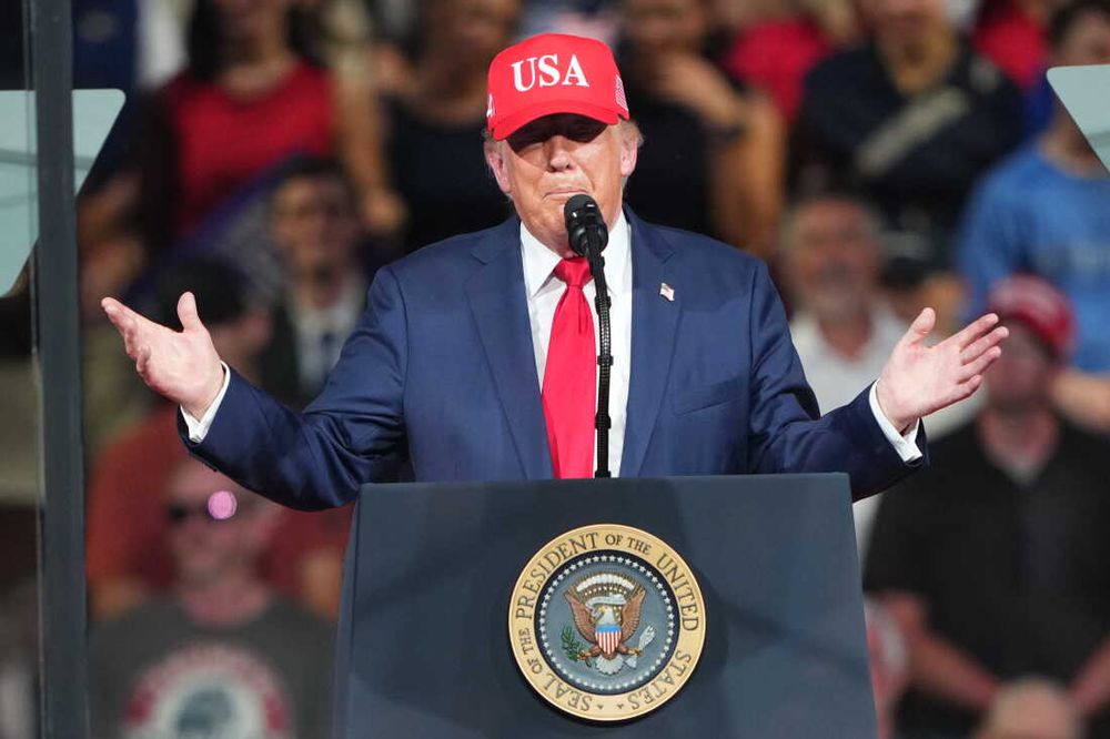 President Donald Trump speaking from a presidential podium