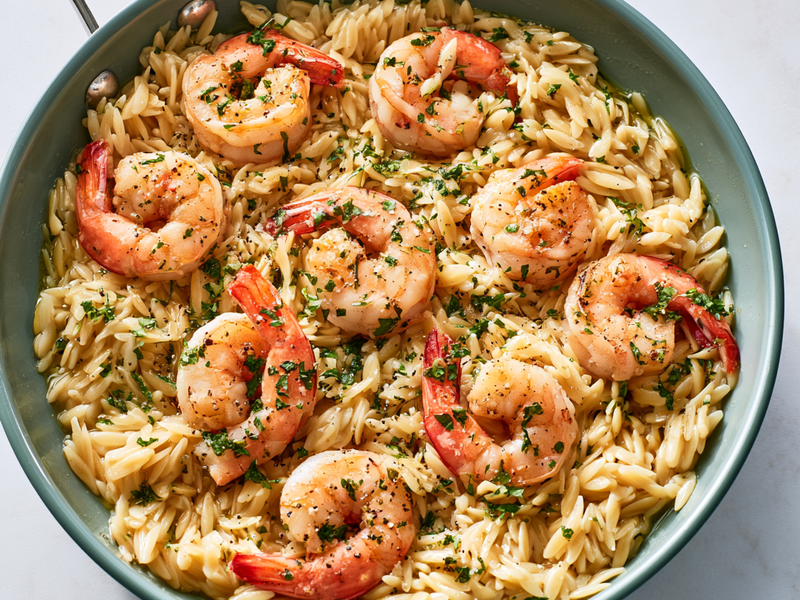 Text: Shrimp cooking in a skillet until pink and tender.