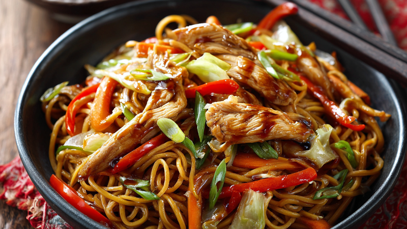 Chicken teriyaki noodle bowl with glazed chicken, stir-fried noodles, and vegetables