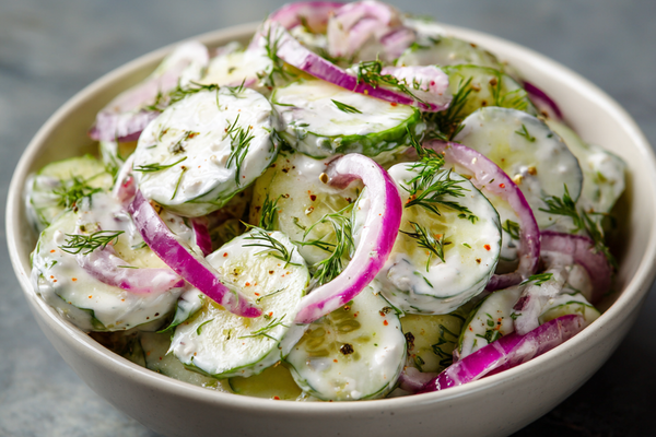 Creamy cucumber salad with Greek yogurt dressing, dill, and red onion