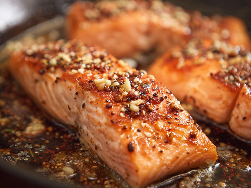 Return salmon to the pan and coat with the sauce.