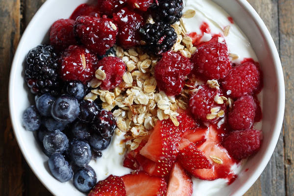 Greek yogurt bowl topped with fresh berries, granola, and honey, healthy high-protein breakfast