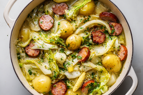 Cabbage boil with sausage, potatoes, corn, and tender cabbage in a pot
