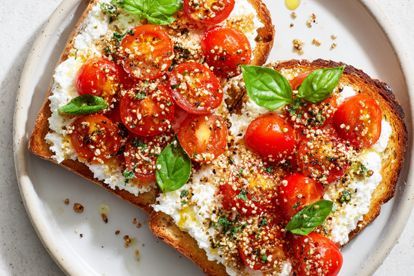 Cottage cheese tomato toast topped with everything bagel seasoning on sourdough