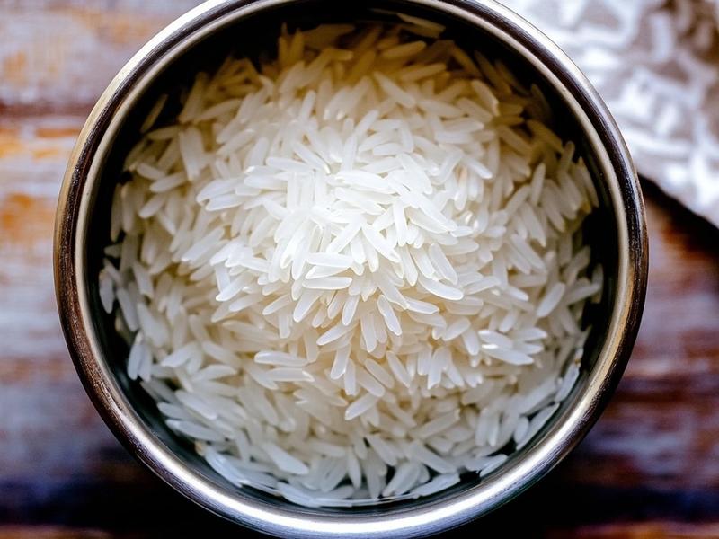 Rinsed raw white rice in a small pot ready to cook