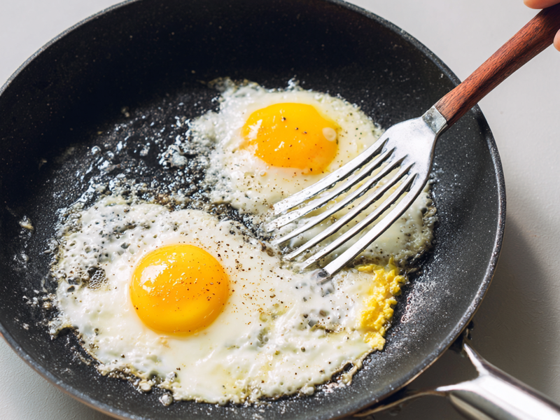 Crack eggs into the pan and scramble until just cooked.