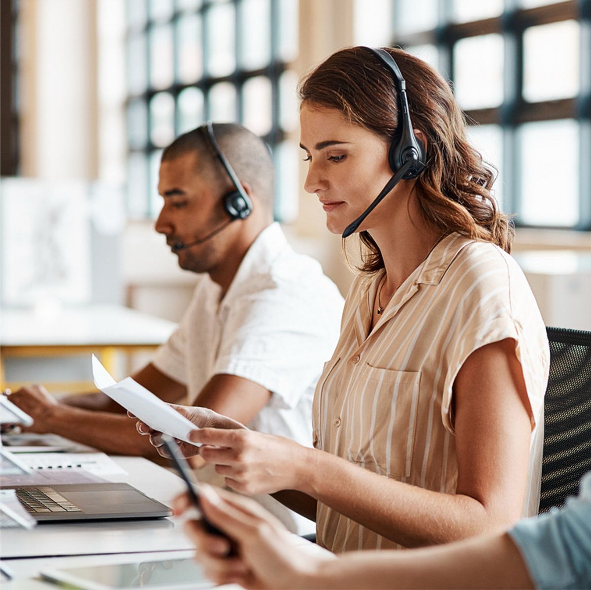 Woman and man working in call centre