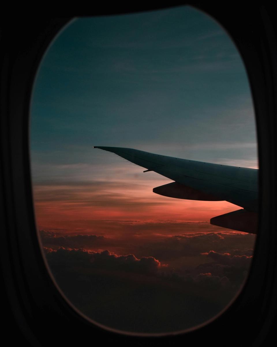 plane window with sunset