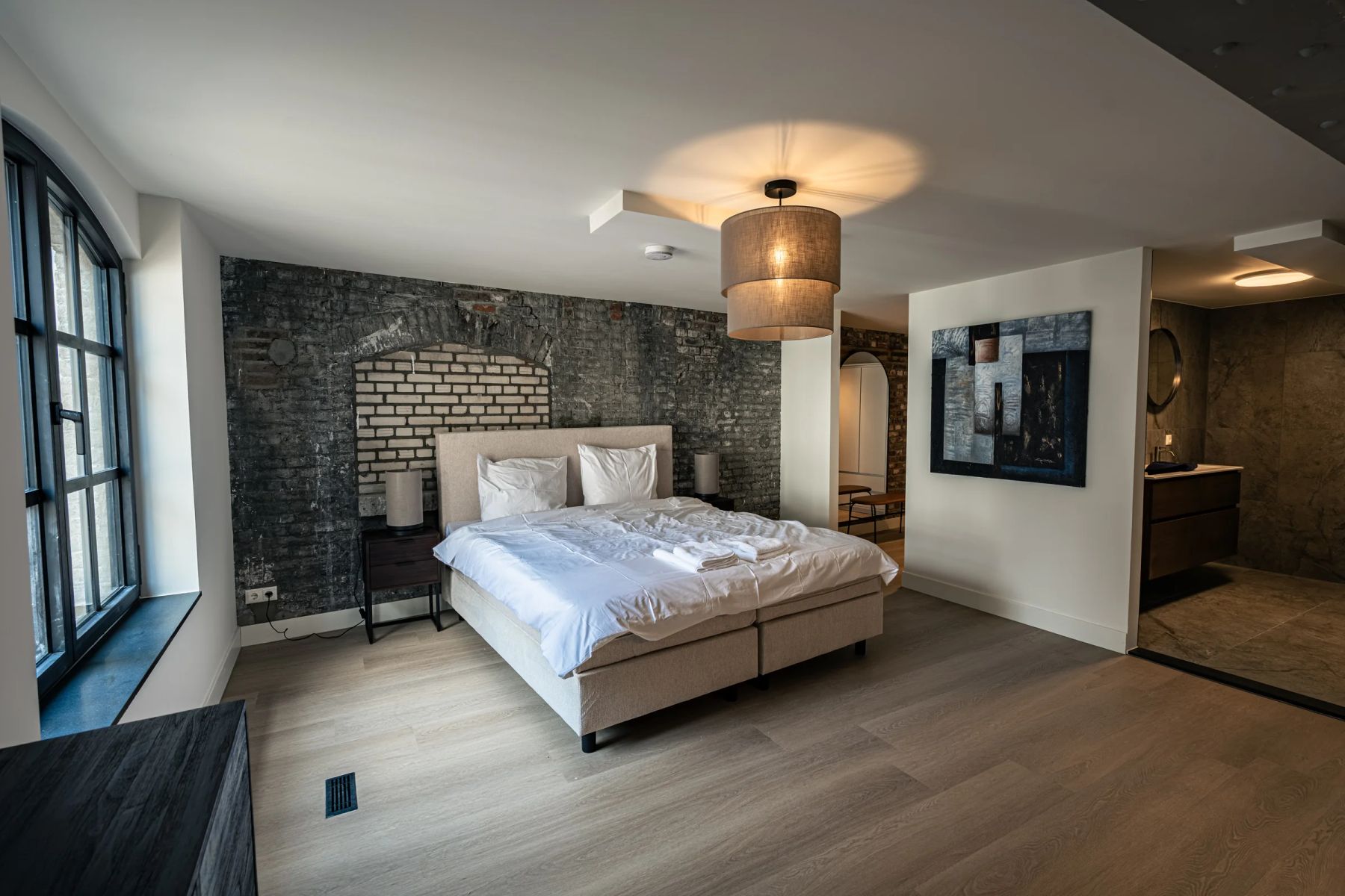 Bedroom with brick wall