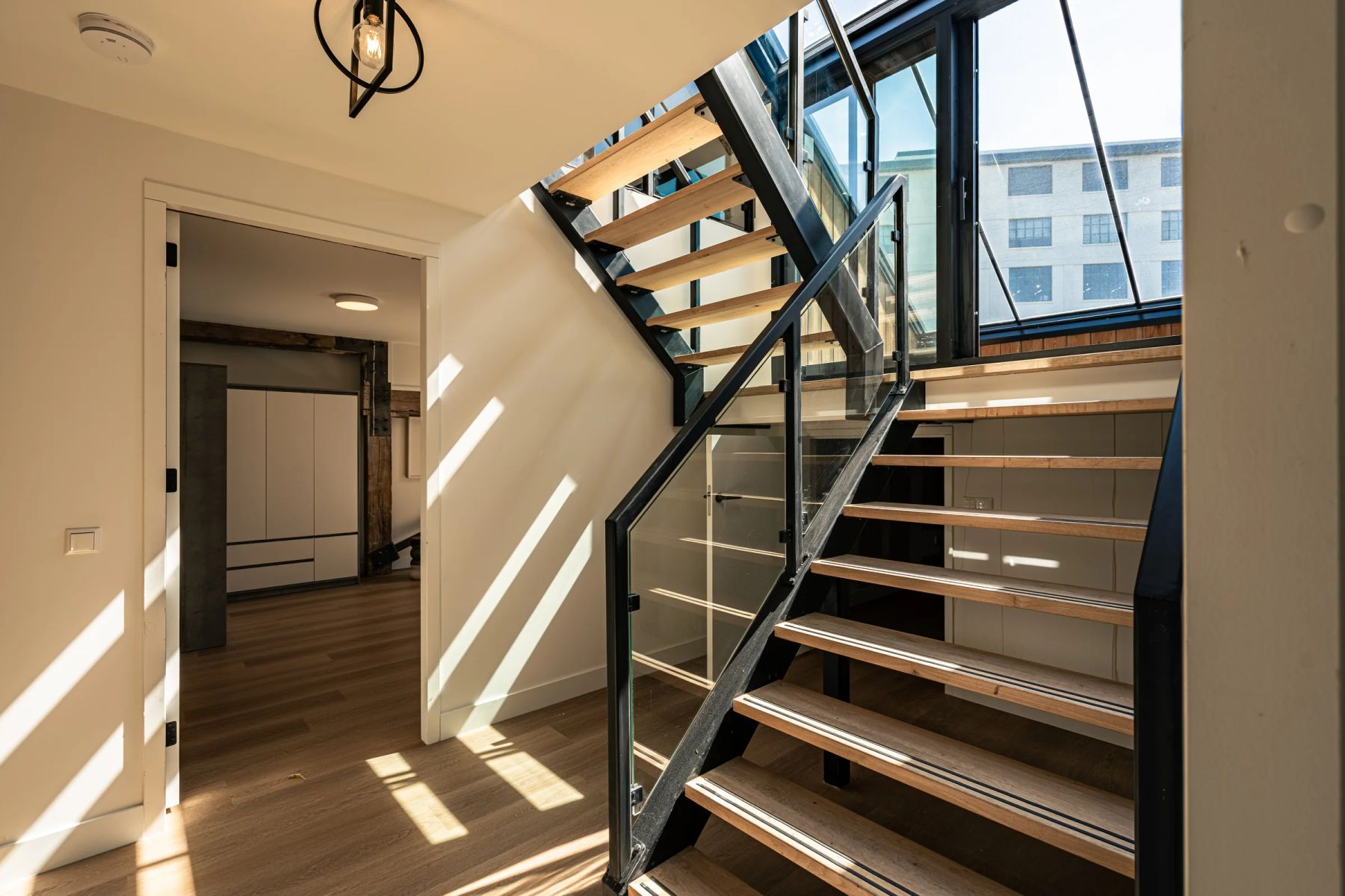 Glass staircase in sunlight