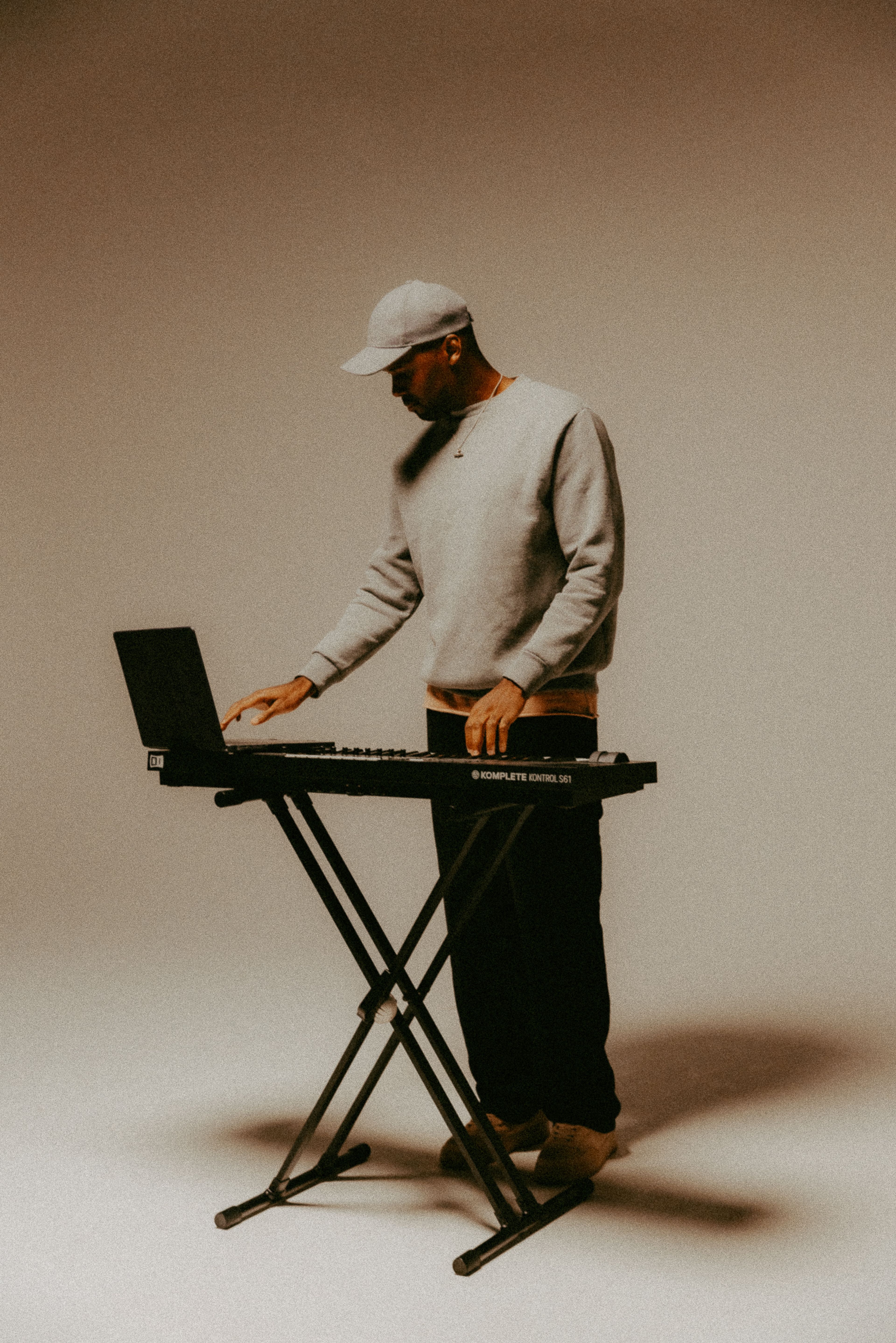 An editorial photo of Raf from Hale Zero playing a keyboard. 