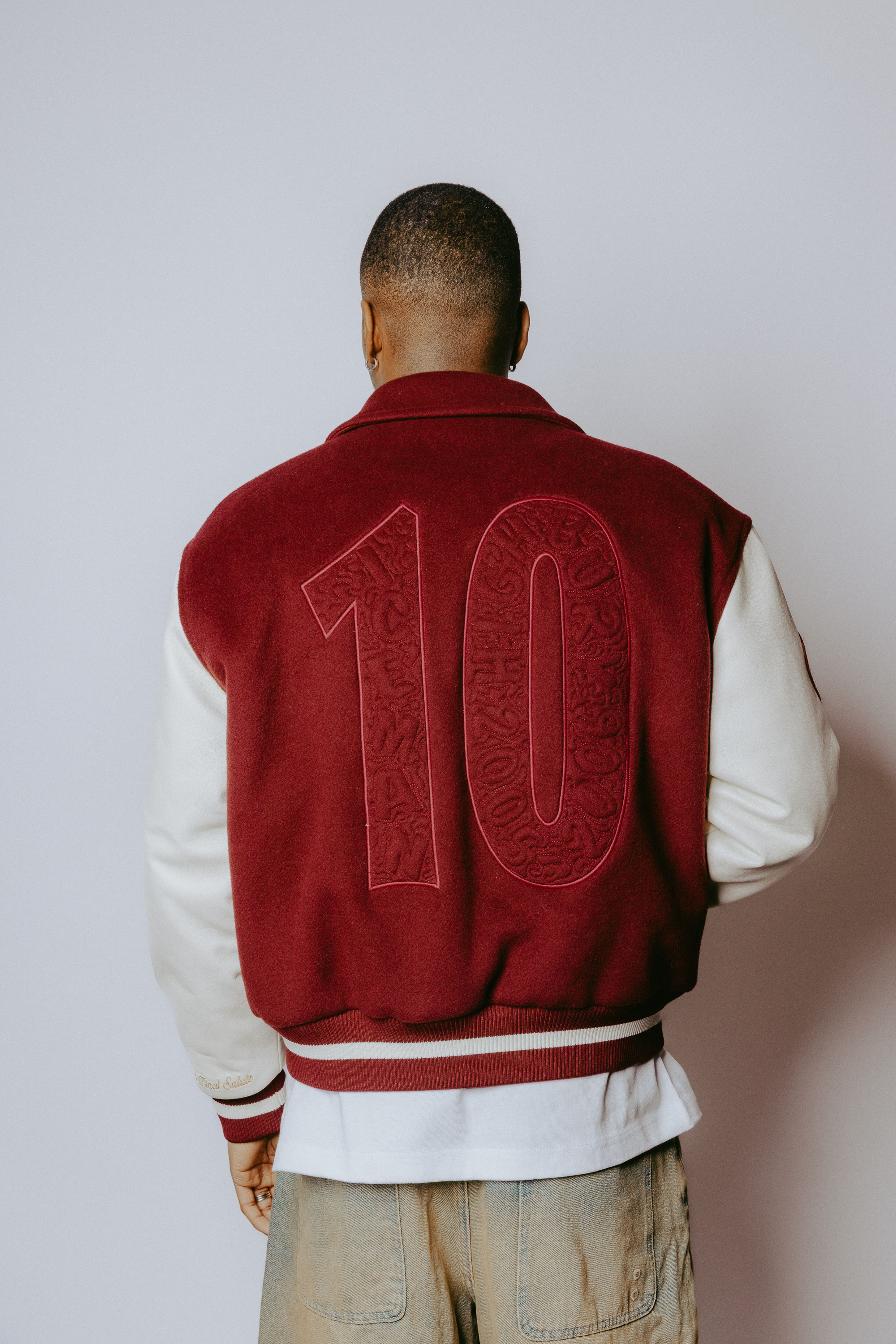 Editorial shot showing the back of the jacket with model