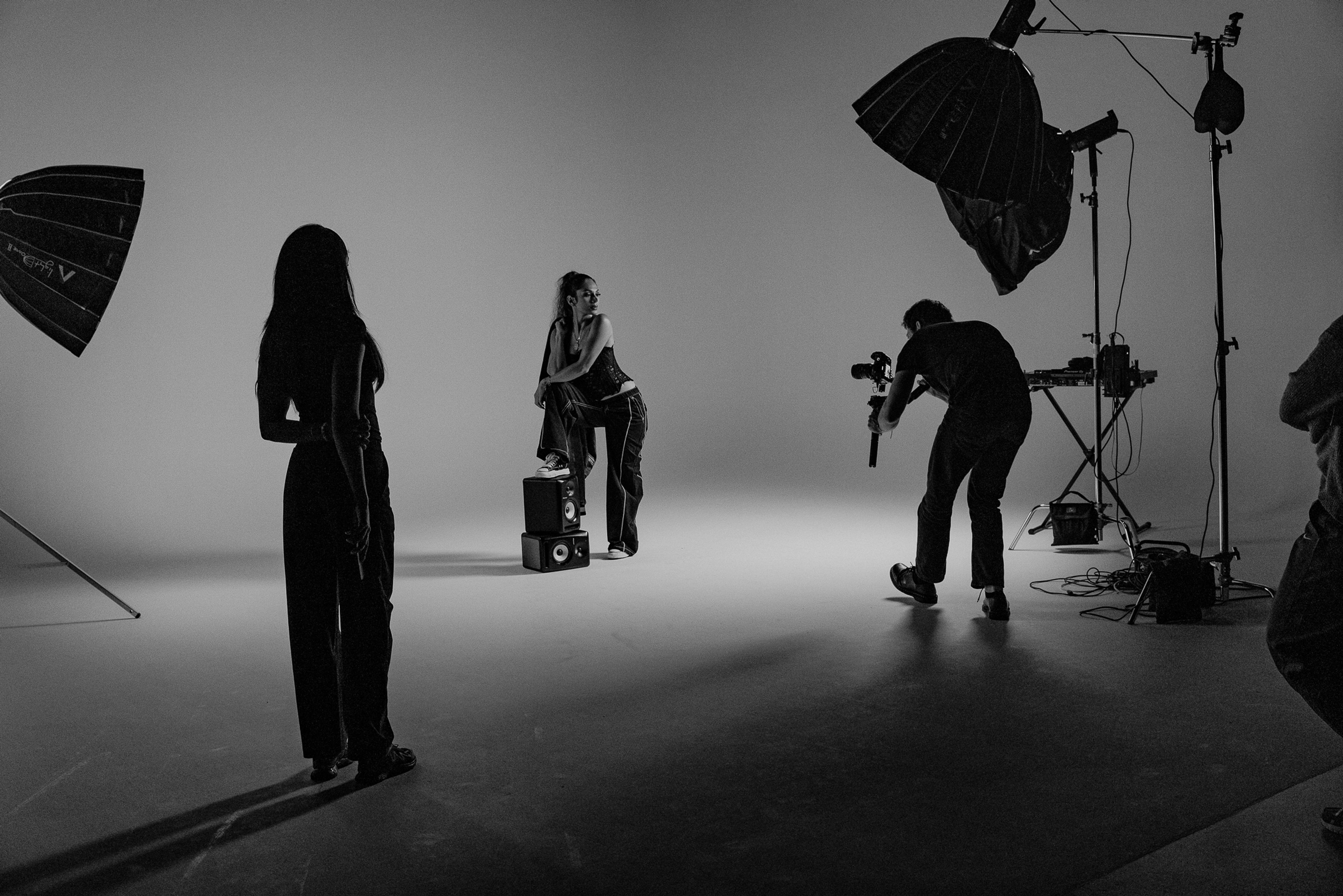 A behind the scenes photo of Oli, Diya and Soraya on set. 