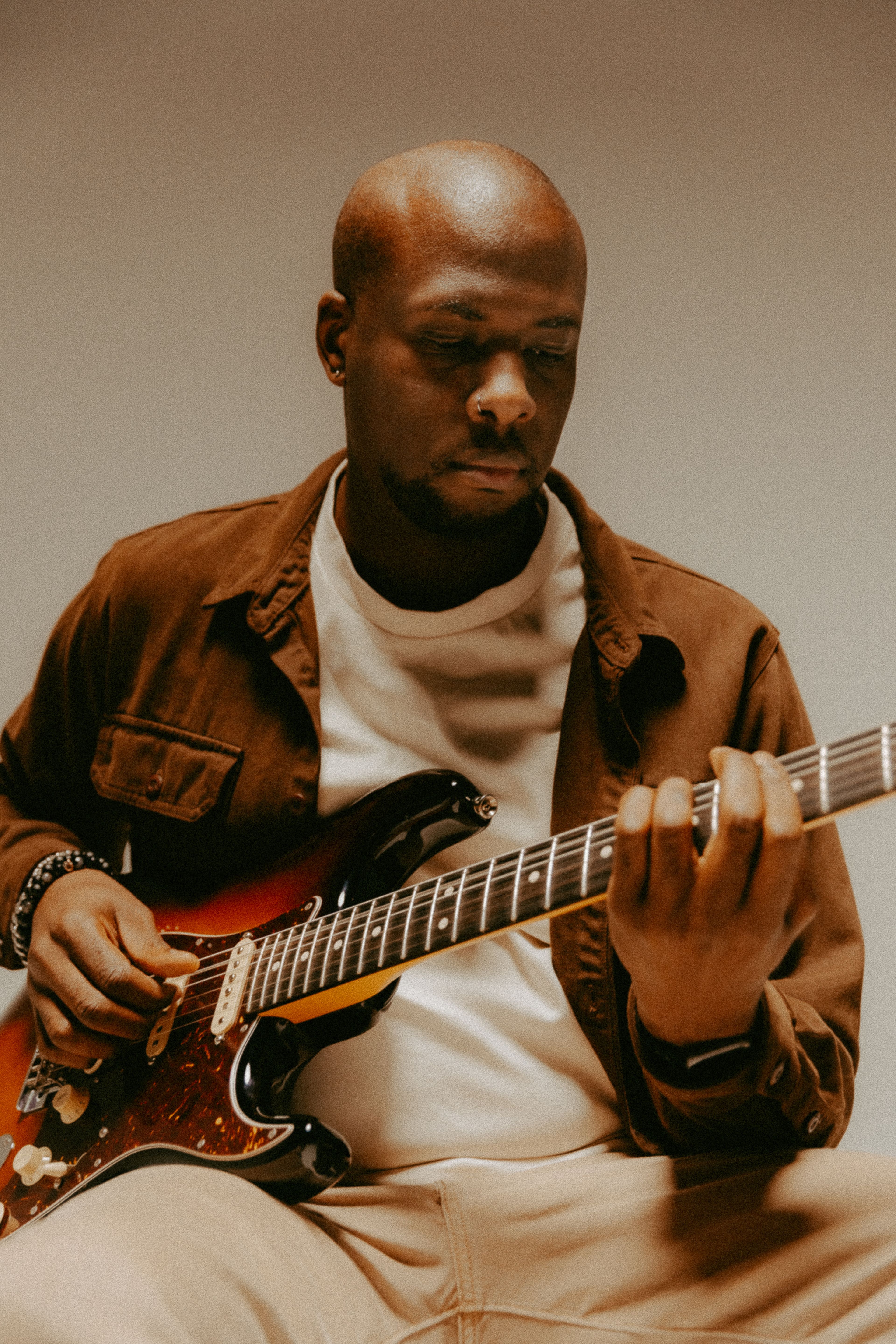 An editorial photo of Greg from Hale Zero playing his guitar. 