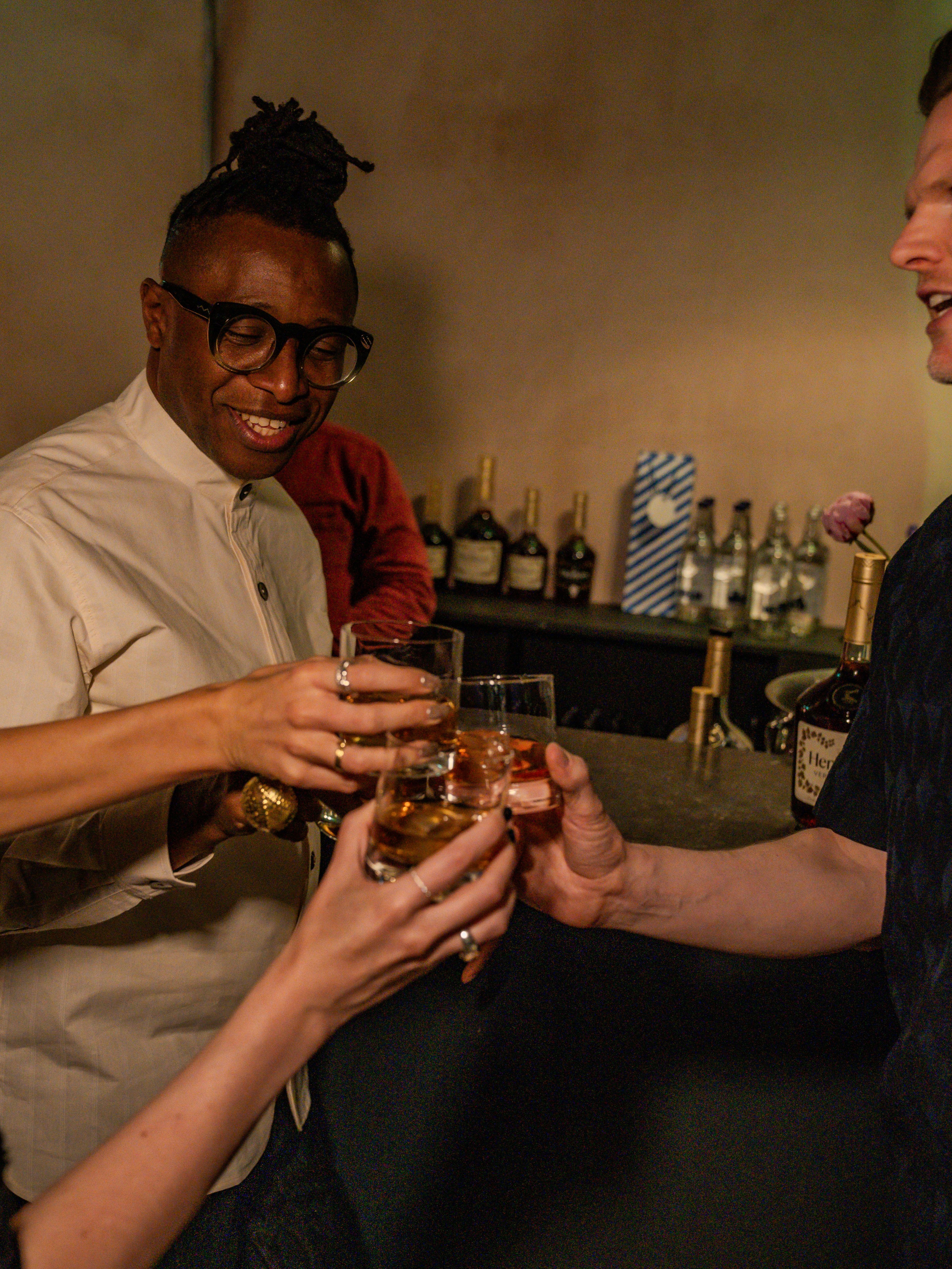 Foday Dumbuya raising a glass