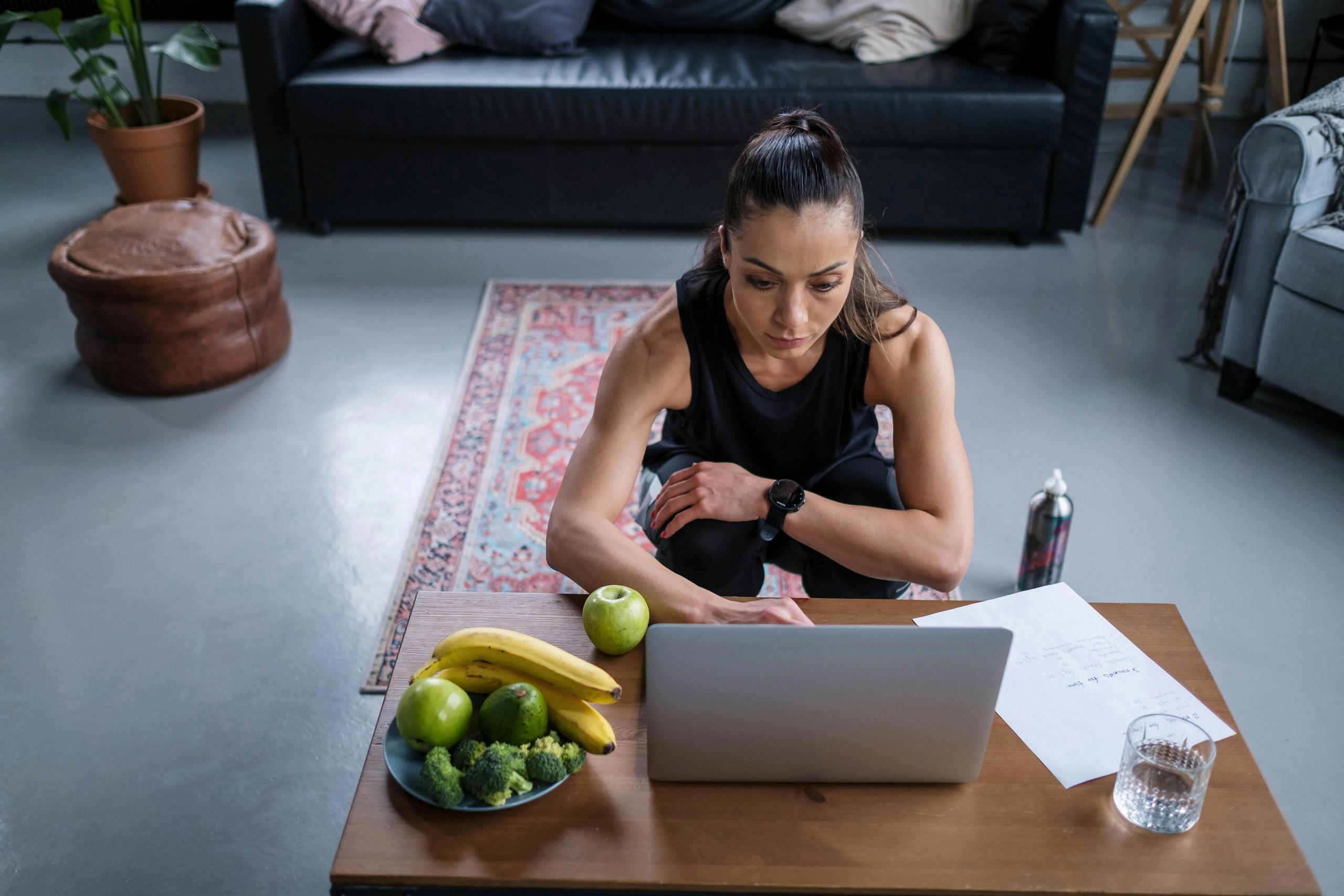 woman focussed with bowl of fruits