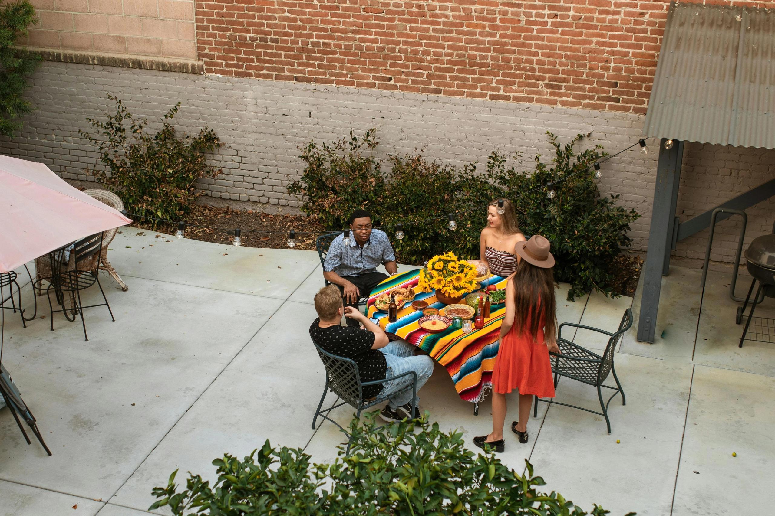 Friends enjoying a meal together outside.
